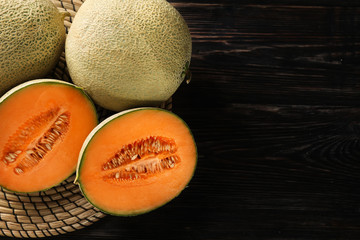 Ripe melons on wooden background