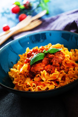 tasty fusilli pasta Italian meat sauce pasta on the table