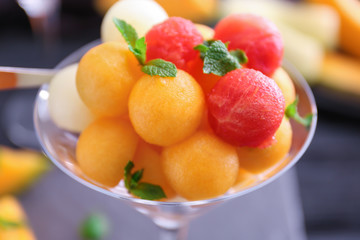 Glass with tasty melon balls, closeup