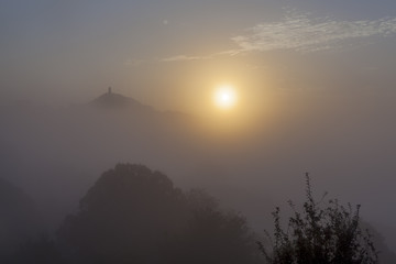 Misty sunrise at Glastonbury Tor
