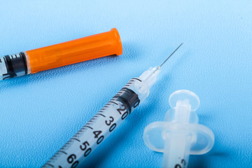 Syringe for injecting insulin to measure level blood sugar.