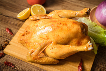 Roast chicken on the wooden table
