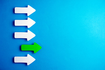 white arrows on a blue background. leadership purposefulness self-development concept