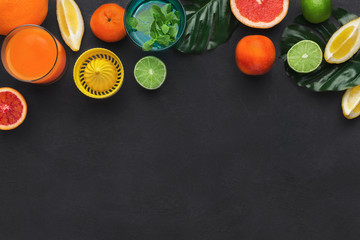 Citrus fruits and glass of fresh juice