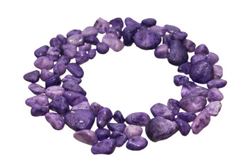 Ring of purple pebbles isolated on white background