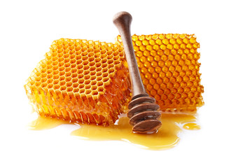 Honeycomb with honey on white background