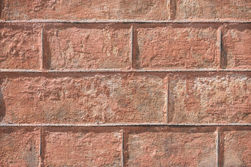 close-up view of brown weathered brick wall background