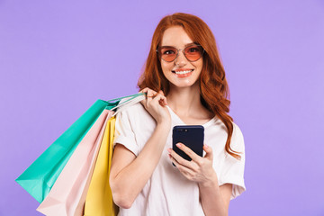 Portrait of a smiling young girl in sunglasses