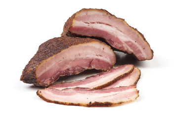 Smoked rustic farmer meat with slices, isolated on white background.