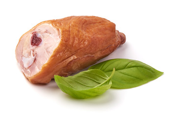 Smoked chicken drumstick with basil leaves, isolated on white background.