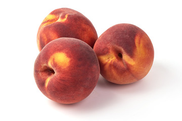 Fresh ripe juicy peaches, isolated on white background.