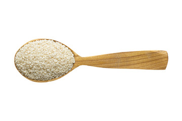 sesame seed in wooden spoon isolated on white background. spice for cooking food, top view.