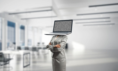 Business woman with laptop instead of head.