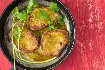 Pork chops in salsa verde.