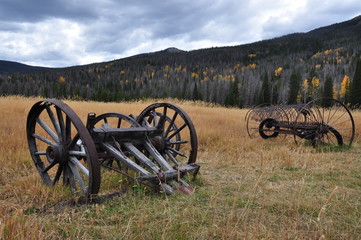Old Wagon Hitch or Plow, Farming Equipment in Foreground of the Rocky Mountains