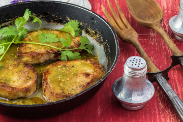 Pork chops in salsa verde.