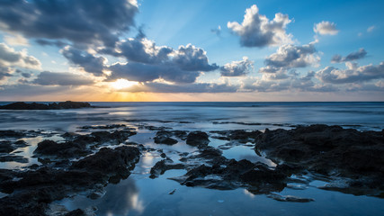 Fototapeta na wymiar Long exposure sunset on Palmahim rocky Beach- Israel