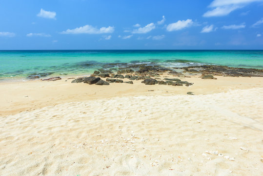 Beautiful beach and tropical sea and rocks in Thailand.