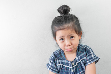 Crying Cute Little Asian Girl on white background