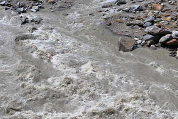 Splashing waters of a mountain river. Mountain torrent in Tyrol, Austria.