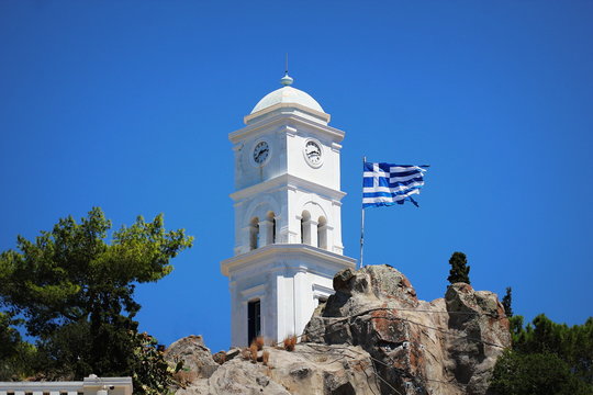 Fototapeta The clock tower of Poros island, Greece.