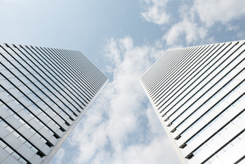 Fototapeta na wymiar Low angle view of tall skyscraper office buildings