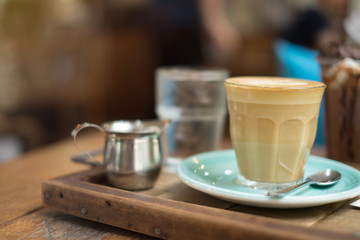 Fototapeta na wymiar Hot latte on wooden table