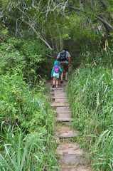 Father and Daughter Hiking on a Cloudy Day Near Glenwood Springs at Rifle Falls