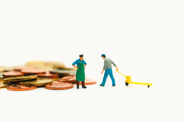 Miniature people, chief control worker lifting stack coins using as business and financial concept