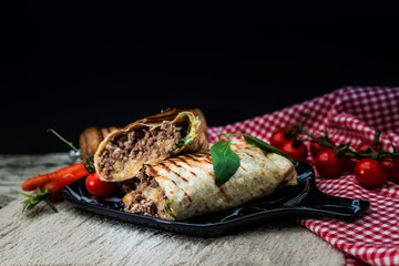 Mexican fajita wraps with grilled chicken fillet and fresh vegetables