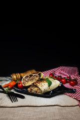 Mexican fajita wraps with grilled chicken fillet and fresh vegetables
