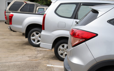 Closeup of rear side of bronze car park in parking area in sunny day.