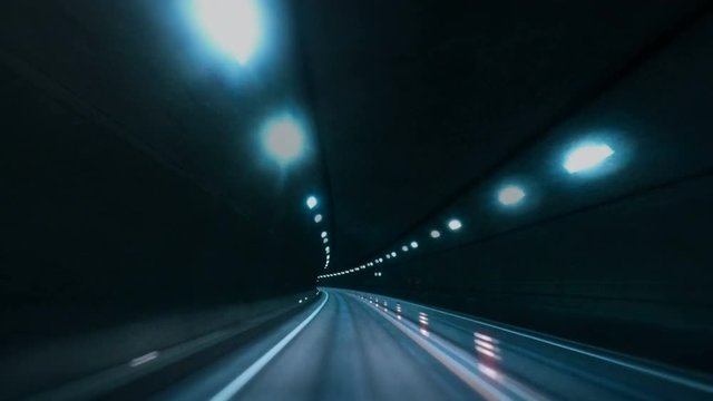 Car POV shot : Blurred motion tunnel. Shot from a slow moving car