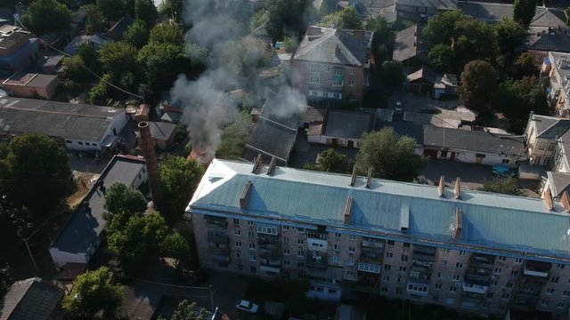 Garage in fire in middle of the city in east Europe sunny weather