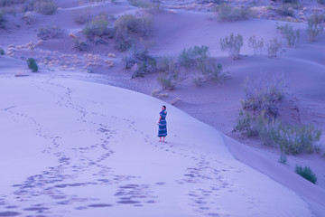 young girl in the sandy desert