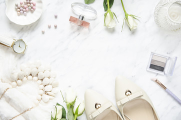 Feminine accessories on a marble dressing table. Top view, flat lay