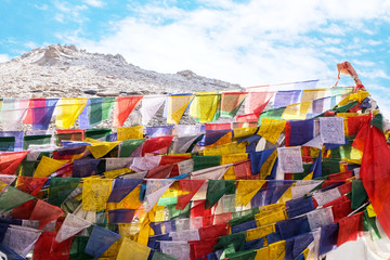 Colorful Tibetan prayer flags with sunshine on the mountain in Leh, Ladakh India.