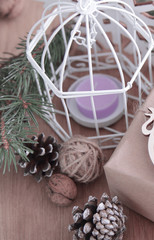 closeup of vintage Christmas candle on a wooden background.