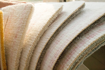 Samples of a multi-colored carpet, an example of pile and carpet color