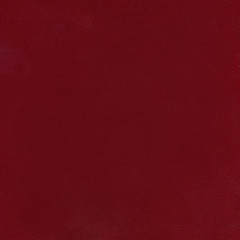 texture of the burgundy velvet. The background of burgundy cloth. .