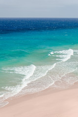 ocean landscape. blue and deep blue water of ocean and beach with surf wave