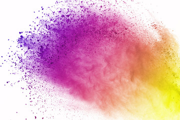 Abstract of colored powder explosion on white background. Multicolor powder splatted isolate....