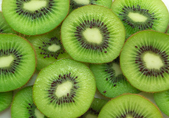 Top view of sliced kiwi as background.
