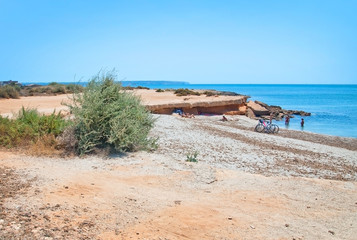Fototapeta na wymiar Seascape with flat ground and bike on a sunny summer day in Mallorca, Spain.