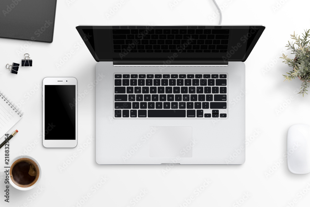 Poster laptop and smart phone on office desk. blank screen for mockup, app or responsive web site design pr