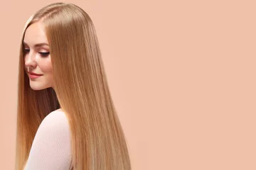 Beautiful Blonde Woman Beauty Model Girl with perfect makeup and long straight hair on light copyspace © Yuliya Ochkan