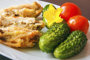 Fresh natural gherkins and organic tomatoes to poultry chicken meat. Healthy food