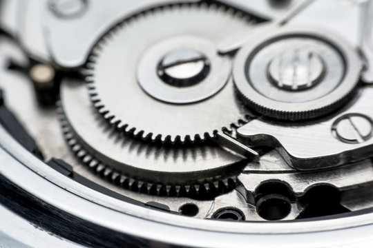 Mechanical watch / Gear Clock. Close up cogs and gears inside clock background
