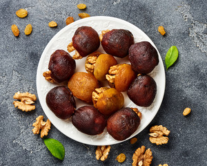 Dessert of dried apricots with walnuts. Top view of Hashtak.