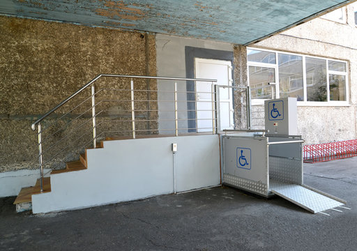 The entrance to the school building equipped with the elevator for disabled people